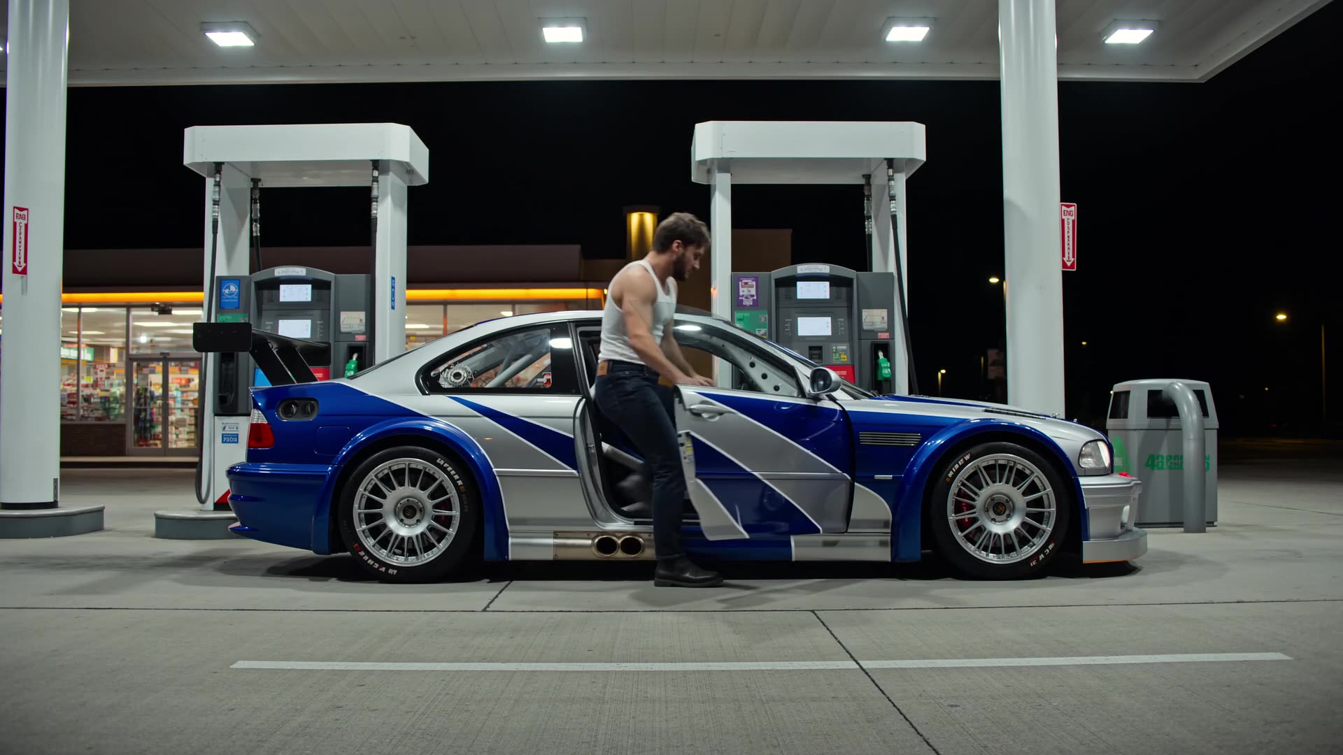 Night short film — blue and white M3 GTR at a petrol station